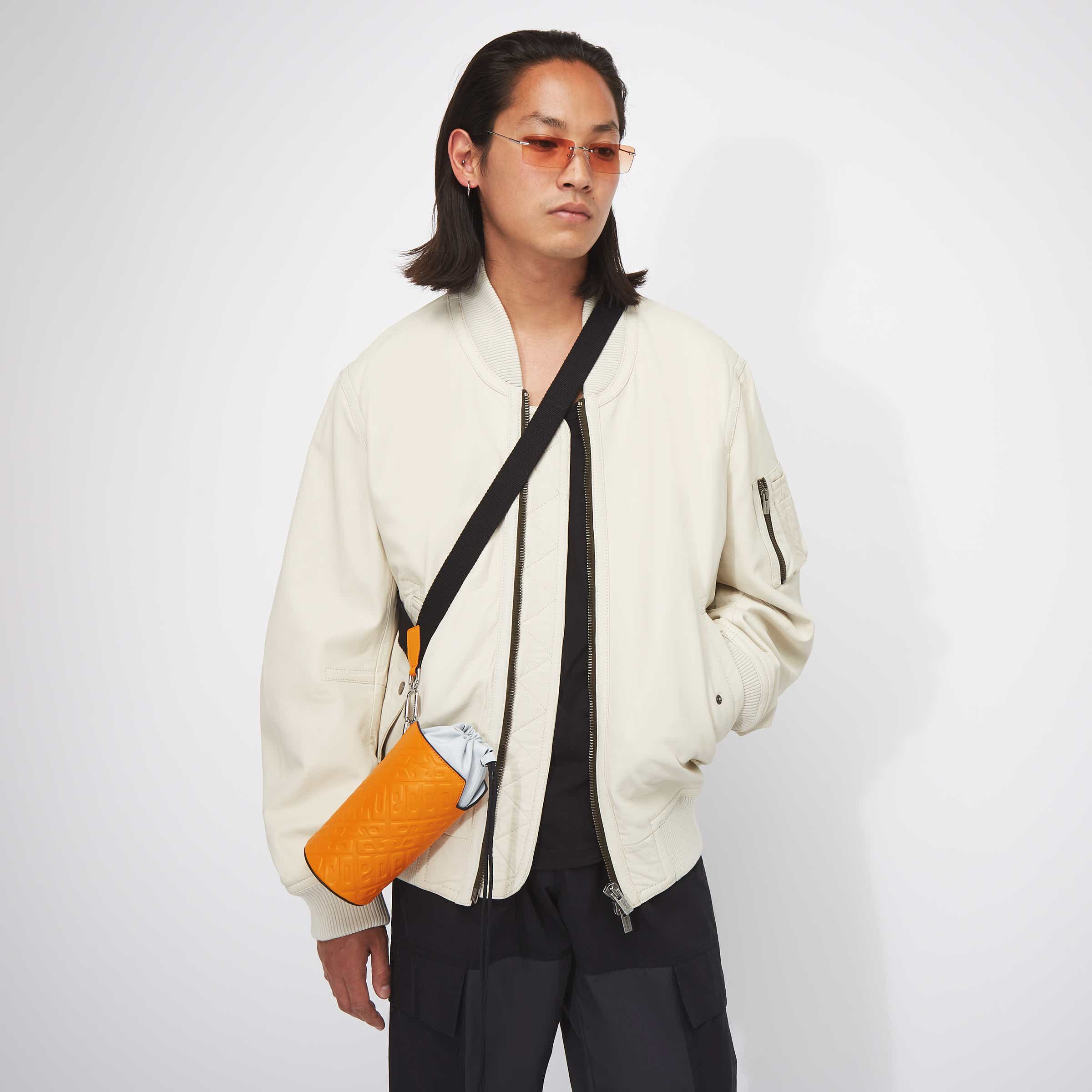 ECCO® E Pot Sling Monogram Leather Crossbody Bag - Orange - Modelshot-1